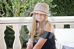 Girl with hat posing