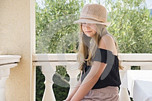 Girl with hat posing