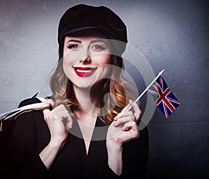 girl in hat with shopping bags and flag of United Kingdom