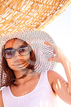 Girl in a hat in summer