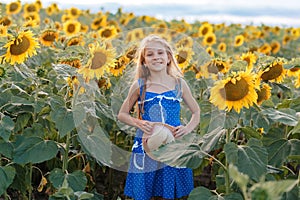 Girl with a hat in a sunflower field