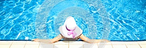 Girl with a hat in waterpool