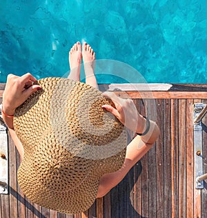 Girl in a hat on a yacht