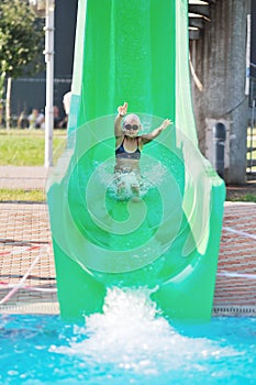 Girl have fun on water slide