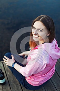 Girl have rest near pond