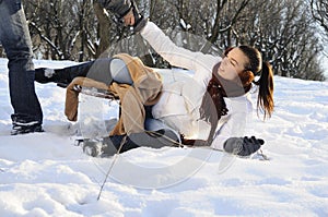 Girl having accident with sledge