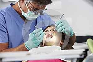 Girl Having Check Up With Dentist