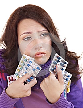 Girl having flu taking pills