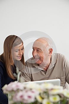 Girl having fun with her grandfather