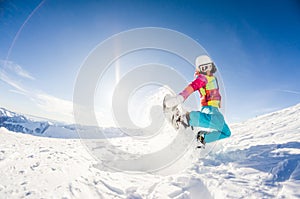 Girl having fun on her snowboard