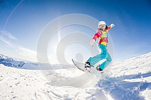 Girl having fun on her snowboard