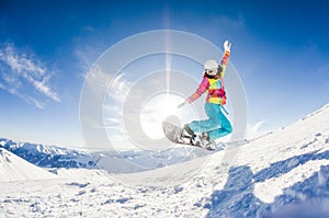 Girl having fun on her snowboard