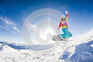 Girl having fun on her snowboard