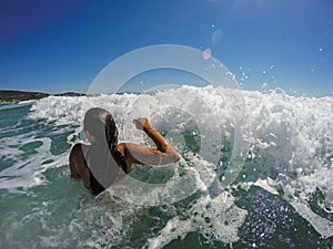 Girl Having Fun In Large Sea Waves