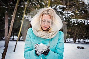 Girl having fun outdoors in snow