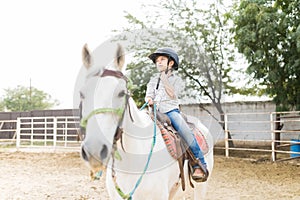 Girl Having Fun While Riding Horse During Weekend