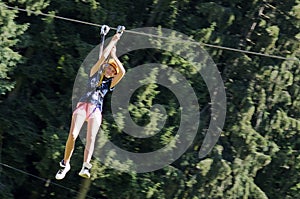 Girl having fun on a rope park adventure