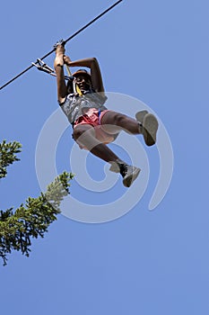 Girl having fun on a rope park adventure