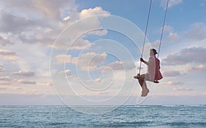 Girl having fun on swing