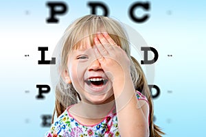 Girl having fun at vision test.