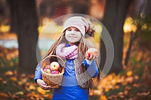 Girl having a picnic in the autumn park