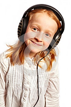 Girl with headphones in a light top view