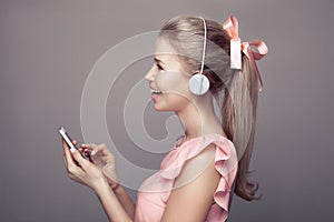 Girl with headphones listening music and having fun.