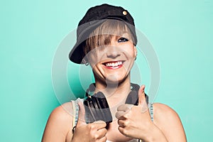 Girl with headphones and positive attitude. Woman with smiling music headphones