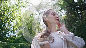 Girl headphones strolling forest nature listening music at smartphone close up.