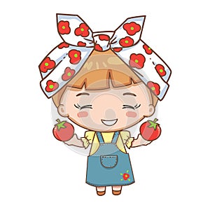 Girl in headscarf holding red tomato