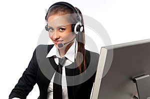 Girl with a headset works at the computer
