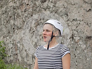 The girl in a helmet for safety.