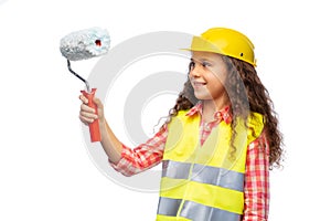 girl in helmet and safety vest with paint roller