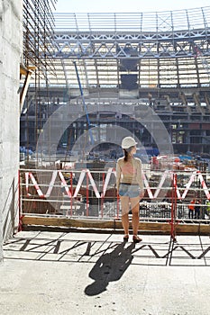 Girl in a helmet watching reconstruction of photo