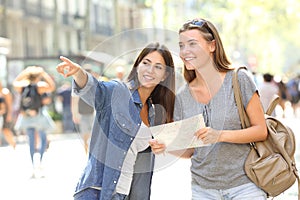 Girl helping to a tourist who asks direction