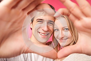 Girl and her boyfriend making heart