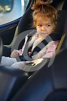 Girl in her car seat- family, transport, road trip concept