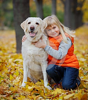 Girl with her dog labrador