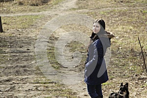 Girl and her dog in park