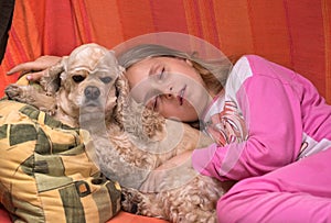 Girl and her dog sleeping together