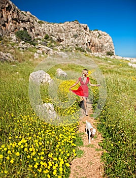 A girl with her dog on a summer path,cyprus