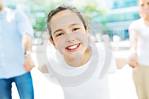 Girl with her family in the background