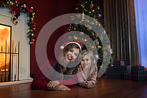 girl with her mama in christmas environment