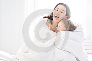 Girl and her mother enjoy sunny morning