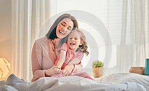 Girl and her mother enjoy sunny morning