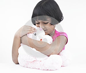 Girl with her pink teddy bear