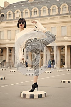 Girl in high heel shoes, fashionable clothes in paris, france