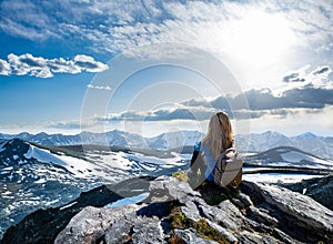 Girl hike relaxing on top of the mountain in Colorado.