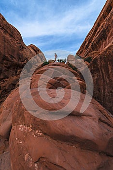 Girl hiker on a Devils Garden trail to Double O Arch