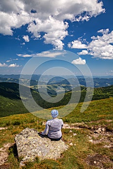 Girl hiker in the mountains with a beautiful view of the Carpathians